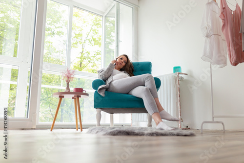 Pregnant woman having a phone conversation