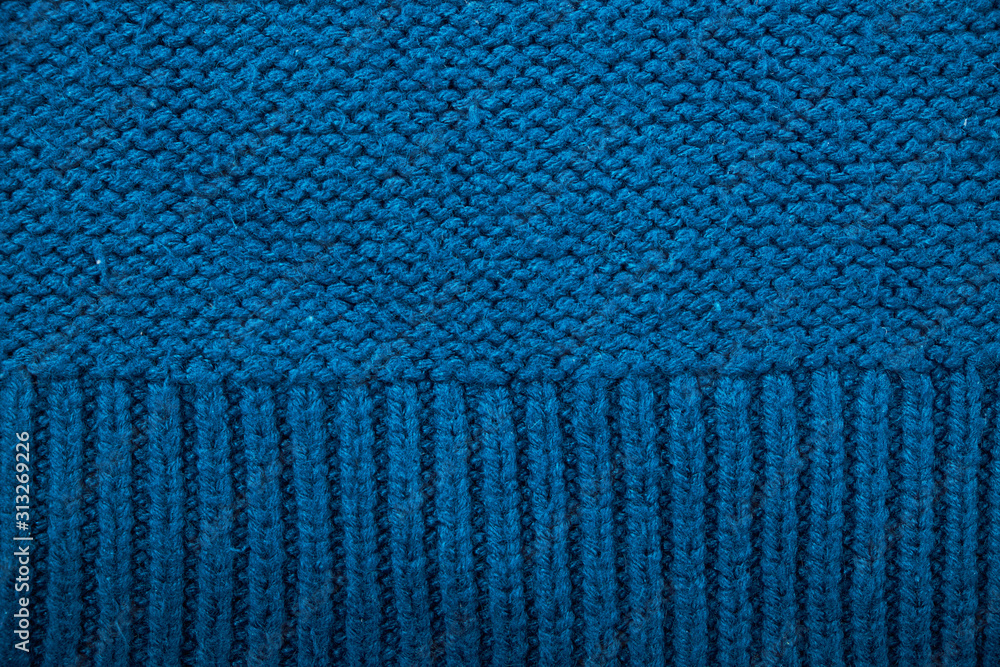 Knitted background. Knitted texture. A sample of knitting from wool. Knitting Pattern. Knitted background. Knitted texture. A sample of knitting from wool. Knitting Pattern.