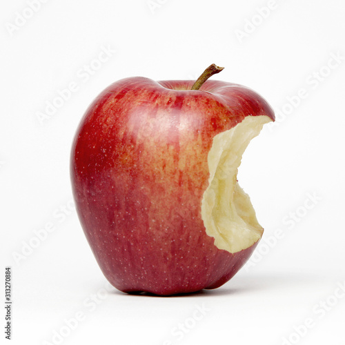 Red apple with a bite out of it, isolated on a white background