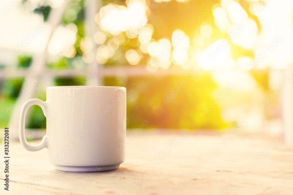 A cup of coffee on the table in the morning. A cup of coffee on the table in the morning.