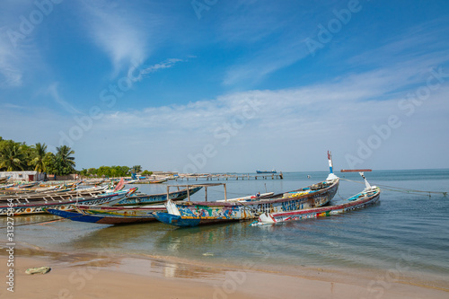 Traditional painted wooden fishing boat in Djiffer, Senegal. West Africa. © Curioso.Photography