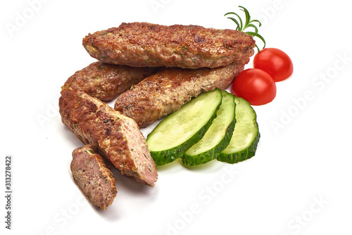 Fried cevapcici, balkan sausages, isolated on white background photo