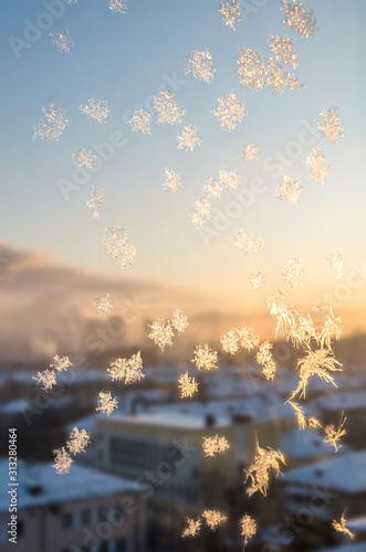 frosty patterns in winter on the window © iloli