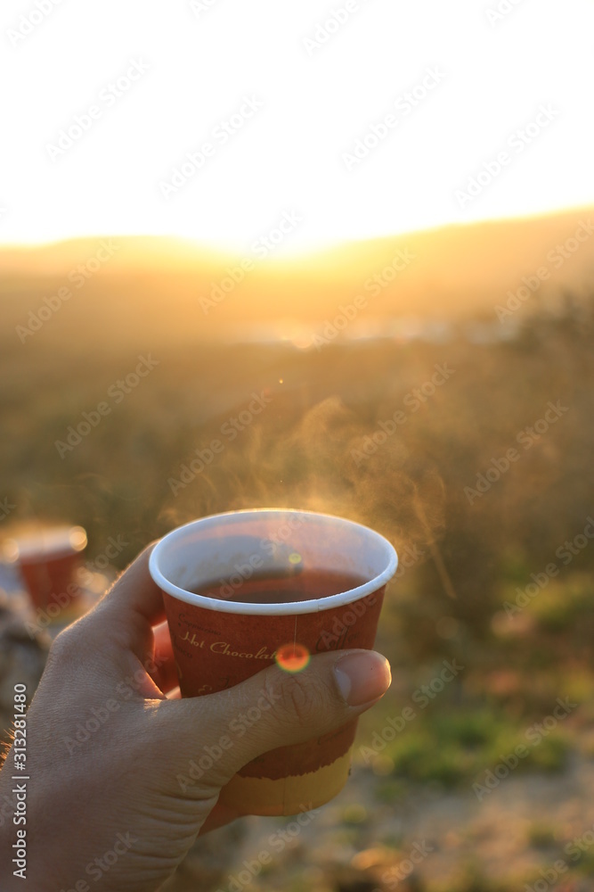 A cup of tea with sunset