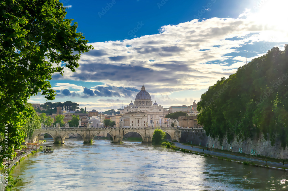 A view along the Tiber River towards St. Peter's Basilica in Rome, Italy.