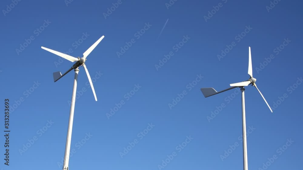 Wind turbines on a background of blue sky. Wind turbines on a background of blue sky.