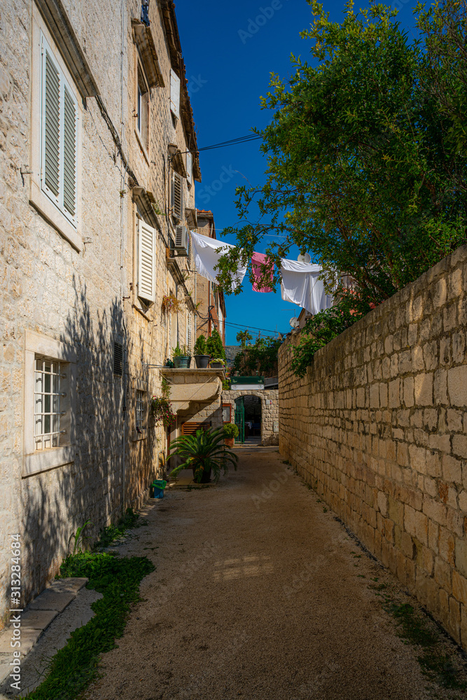 Narrow street in historic town Trogir, Croatia.