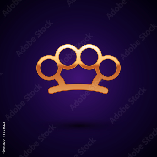 Gold Brass knuckles icon isolated on dark blue background. Vector Illustration