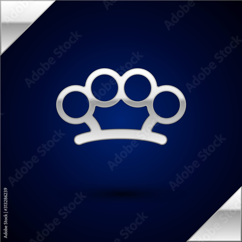 Silver Brass knuckles icon isolated on dark blue background. Vector Illustration