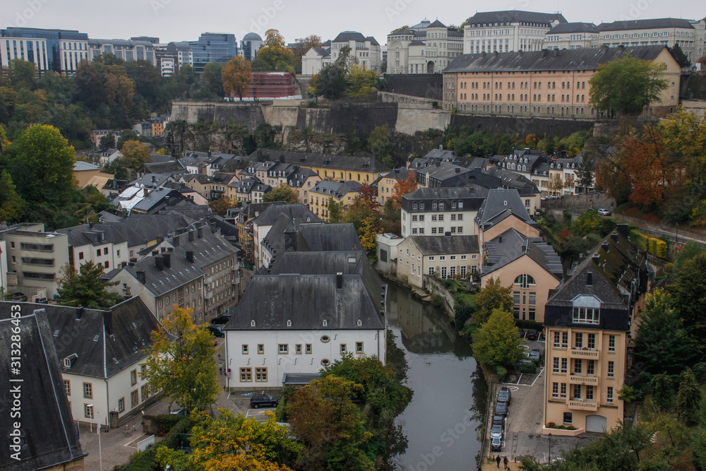 view of the fortified city, the capital of the Grand Duchy of Luxembourg, is the richest state in Europe. Old medieval city with fortified walls, a cathedral and houses in the fall.