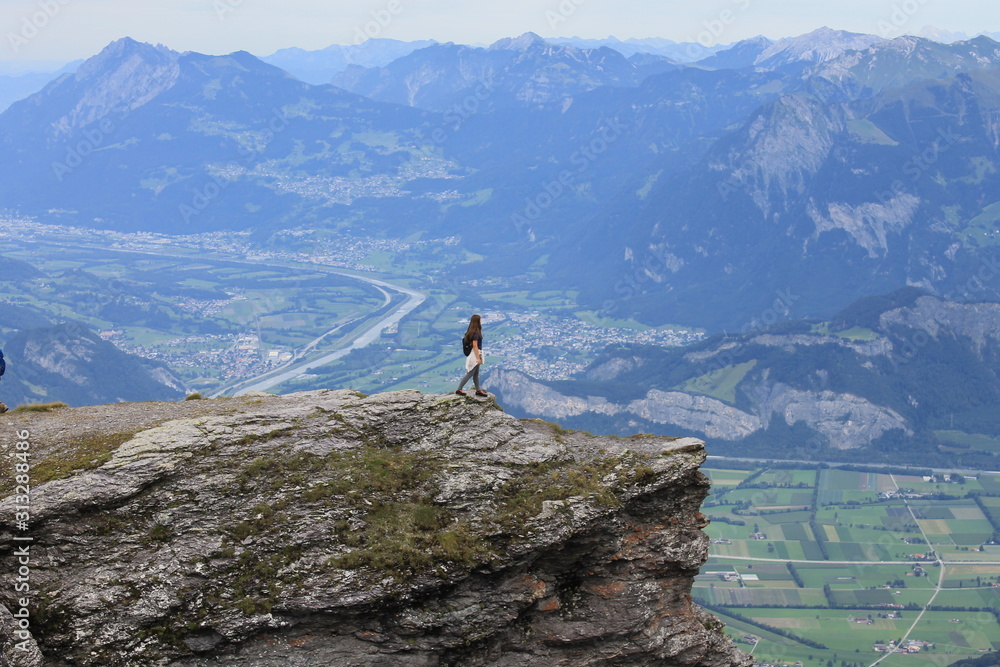 man on top of mountain