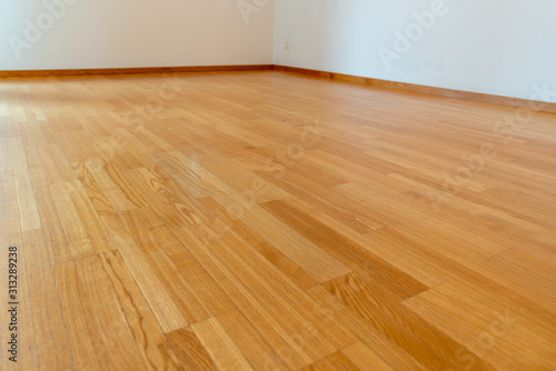 low angle view of wooden parquet floor in a bright and spacious home
