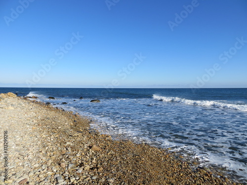 Clear blue sky over the rocky beach at Montauk  Long Island  New York.