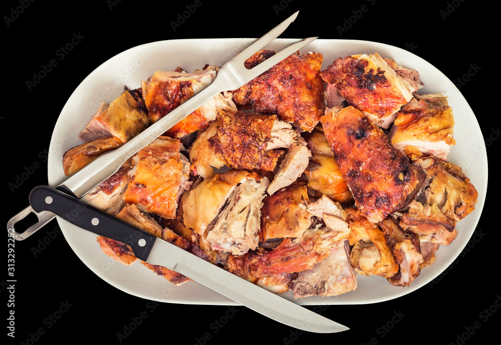 Freshly Spit Roasted Pork Thigh Meat Slices Offered on White Ceramic Porcelain Tray with Serving Knife and Fork Isolated on Black Background Freshly Spit Roasted Pork Thigh Meat Slices Offered on White Ceramic Porcelain Tray with Serving Knife and Fork Isolated on Black Background