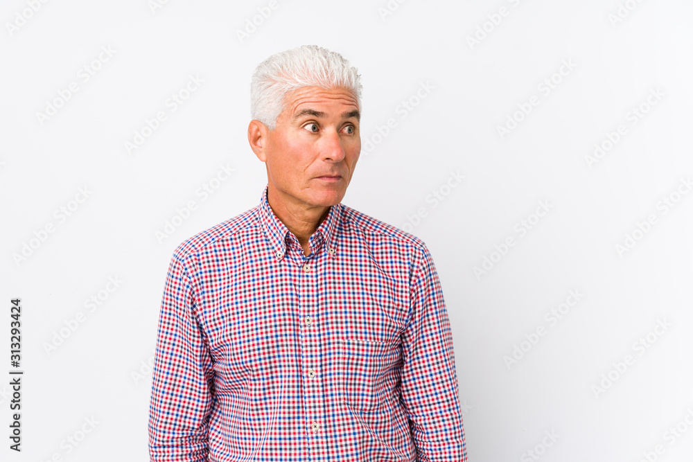 Senior caucasian man isolated confused, feels doubtful and unsure. Senior caucasian man isolated confused, feels doubtful and unsure.