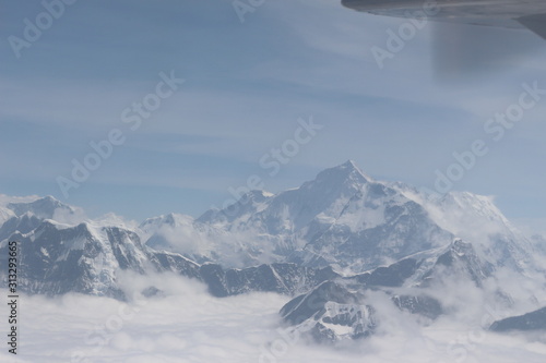 Photography A beautiful photo of a mountain with glacier and snow on it from a height above