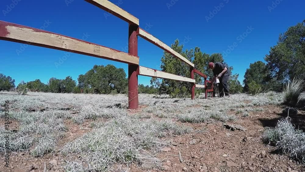 Man On Ranch Paints Fence- Time Lapse Man On Ranch Paints Fence- Time Lapse