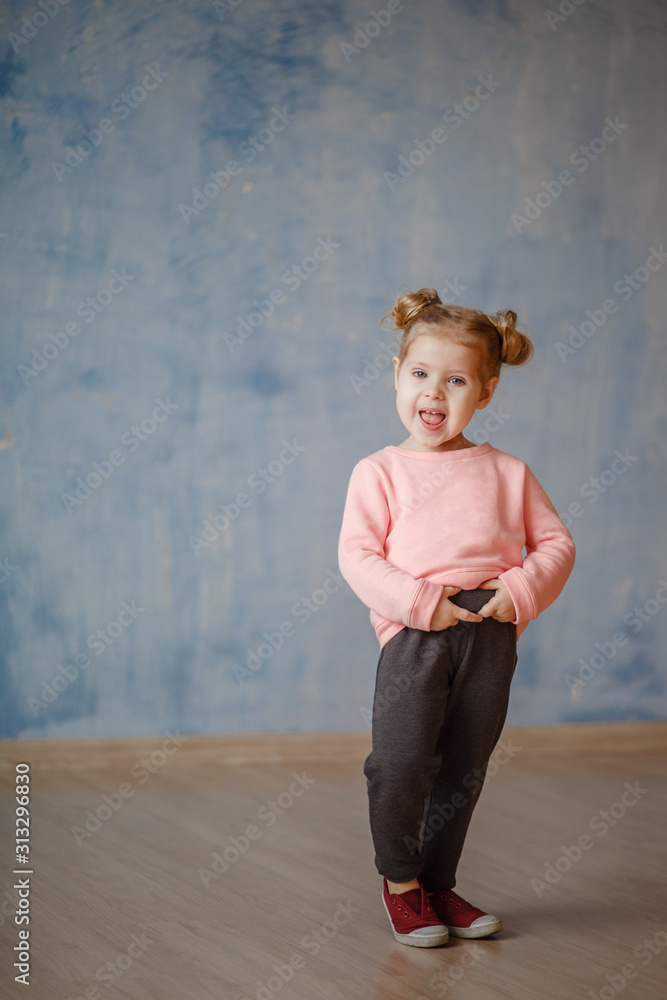 little blonde girl in a tracksuit