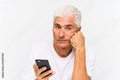 Mature caucasian man talking on phone