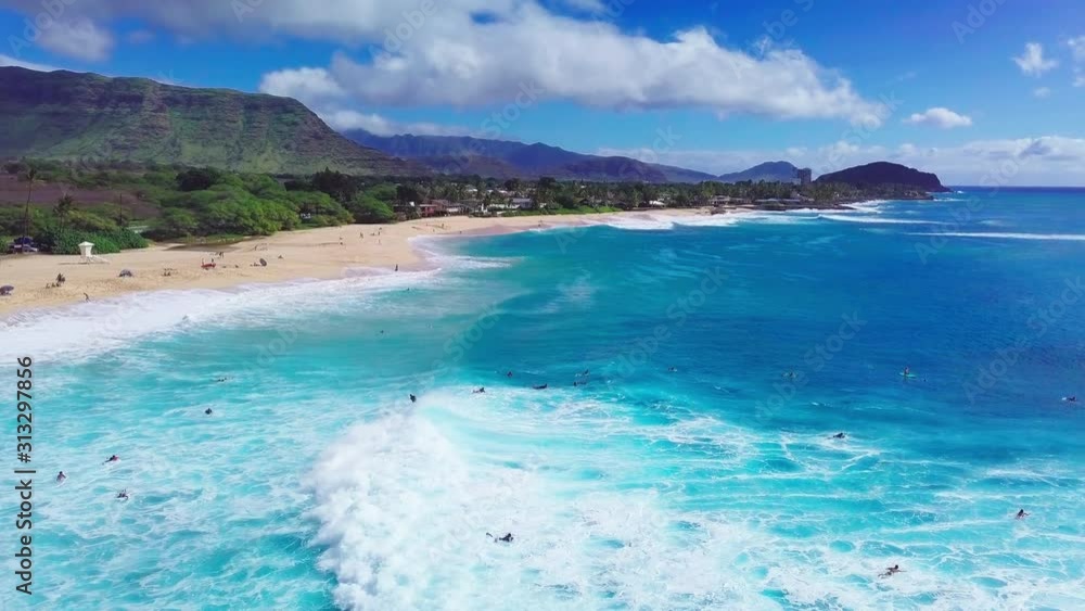 Surfers ride ocean waves at Makaha surf spot in Hawaii Surfers ride ocean waves at Makaha surf spot in Hawaii