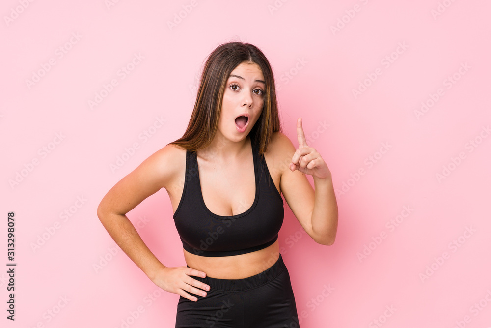 Young fitness caucasian woman isolated having an idea, inspiration concept. Young fitness caucasian woman isolated having an idea, inspiration concept.