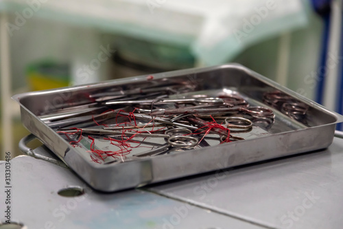 Surgical instruments after surgery are folded in the tray.