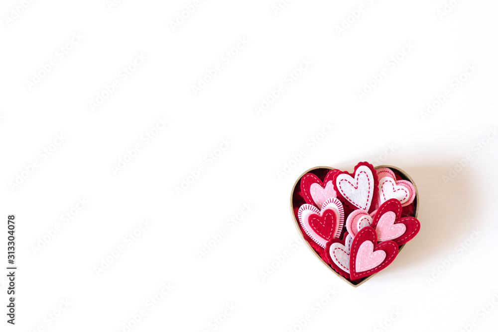 Cardboard box in the form of a heart with different hearts inside on a light background Cardboard box in the form of a heart with different hearts inside on a light background