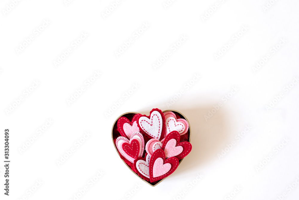 Cardboard box in the form of a heart with different hearts inside on a light background Cardboard box in the form of a heart with different hearts inside on a light background