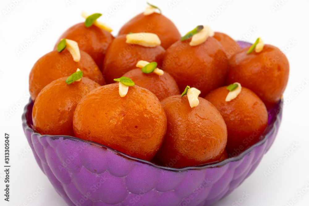 Indian Popular Dessert Gulab Jamun Also know as kala Jamun or Kalajam is a Soft Delicious Berry Sized Balls Made of Milk Solids Indian Popular Dessert Gulab Jamun Also know as kala Jamun or Kalajam is a Soft Delicious Berry Sized Balls Made of Milk Solids