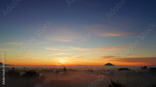 Wallpaper Mural Aerial Rising Shot over Telephone Lines and Foggy Neighborhood in Orange Sunrise Torontodigital.ca