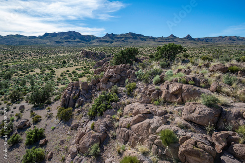 USA, Nevada, Lincoln County, Basin and Range National Monument: Bands of boulders and small cliffs made from dark brown volcanic tuff rocks are characteristic of the Great Basin-Mojave Desert 