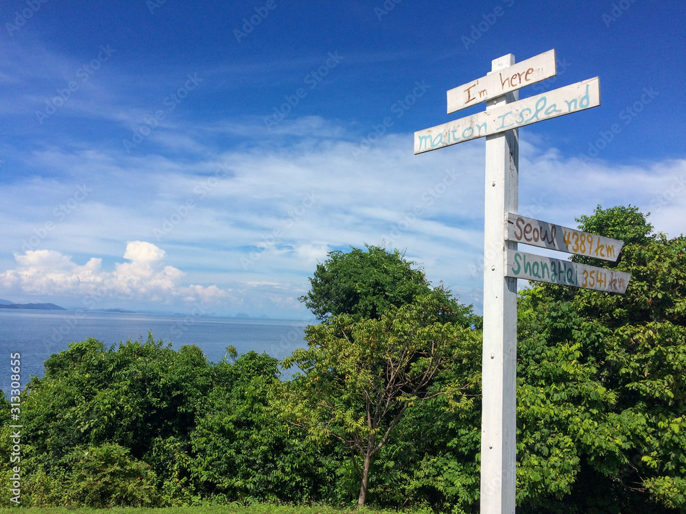 signpost on background of blue sky