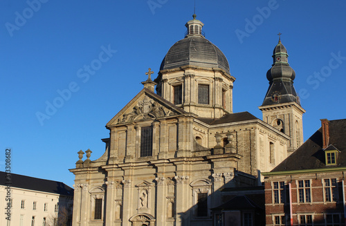 The low winter sun lights Our Lady of St Peters church, which is situated on St Peters Square, in Ghent, Belgium. With copy space.