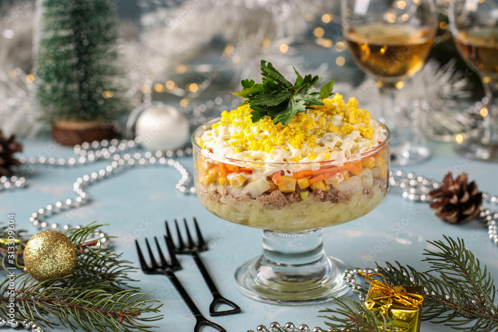 Holiday salad with canned fish, eggs, carrots and potatoes, Traditional Russian food, horizontal orientation Holiday salad with canned fish, eggs, carrots and potatoes, Traditional Russian food, horizontal orientation