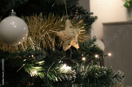 Decorated Christmas tree with festive ornament, silver and gold