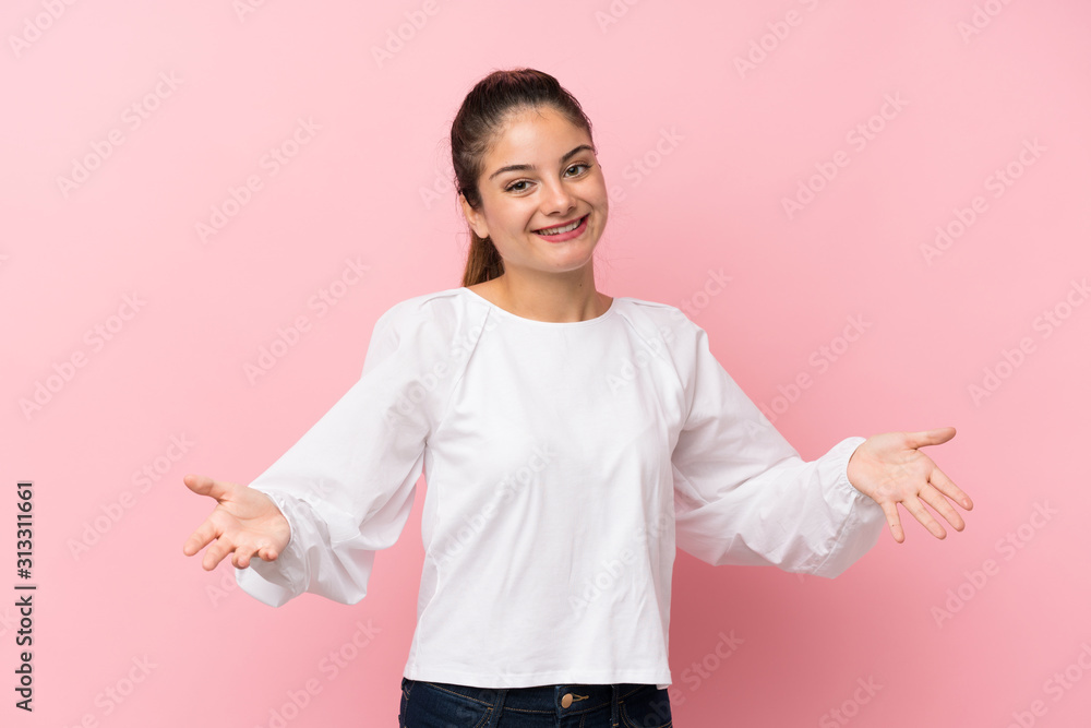 Young brunette girl over isolated pink background smiling Young brunette girl over isolated pink background smiling