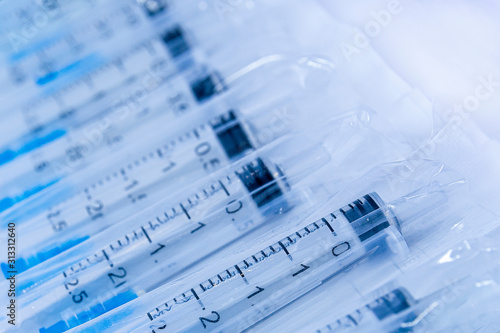 Medical syringes in a package. Medical syringes in packaging as an abstract medical background.