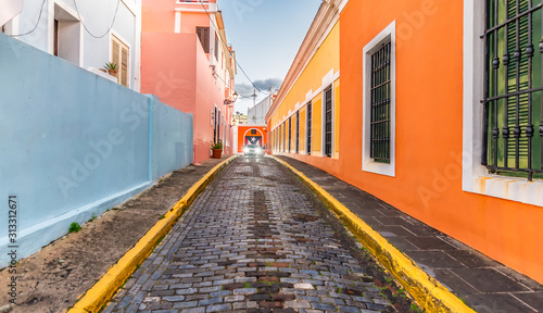 Cobblestone street and colorful houses in city centre of Old San Juan, Puerto Rico. © Nancy Pauwels