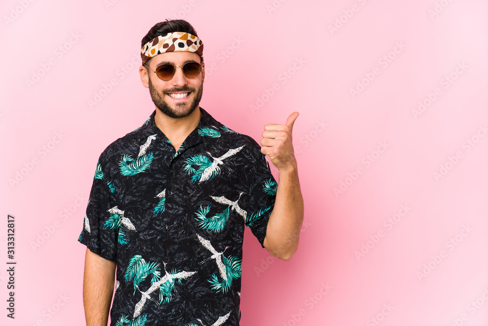 Young hipster man isolated smiling and raising thumb up Young hipster man isolated smiling and raising thumb up