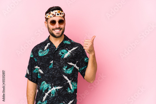 Young hipster man isolated smiling and raising thumb up