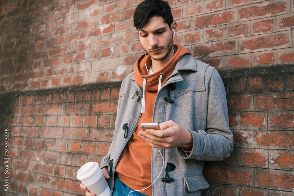 Young man using mobile phone. Young man using mobile phone.