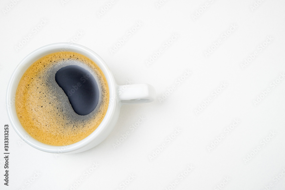 Coffee cup espresso on white kitchen table. Coffee cup closeup. Morning, breakfast, energy, coffee break concept. Top view Coffee cup espresso on white kitchen table. Coffee cup closeup. Morning, breakfast, energy, coffee break concept. Top view