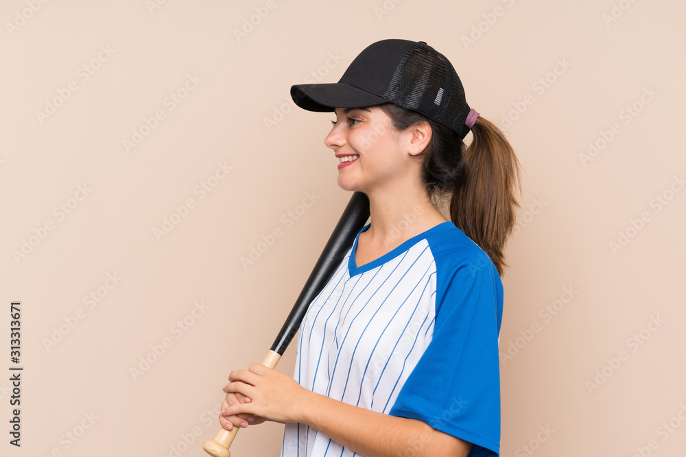 Young girl playing baseball over isolated background looking side Young girl playing baseball over isolated background looking side
