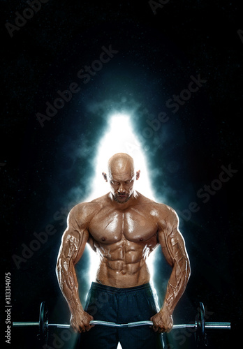 Fit athlete man with barbell in fire. Energy and power. Strong muscular guy bodybuilder. Sport and fitness motivation. Individual sports recreation. © Mike Orlov