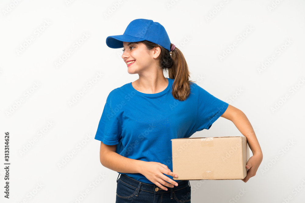 Young delivery girl over isolated white background looking to the side Young delivery girl over isolated white background looking to the side