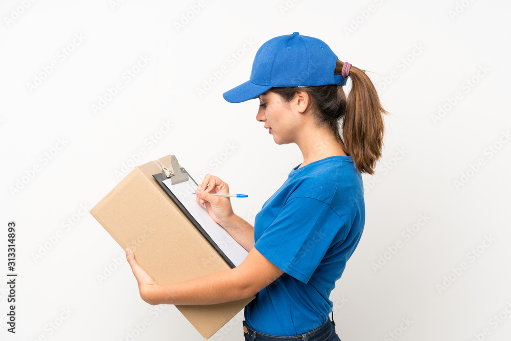 Young delivery girl over isolated white background Young delivery girl over isolated white background