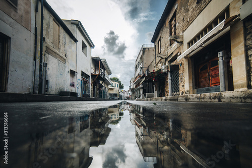 street in limassol after rain with shops