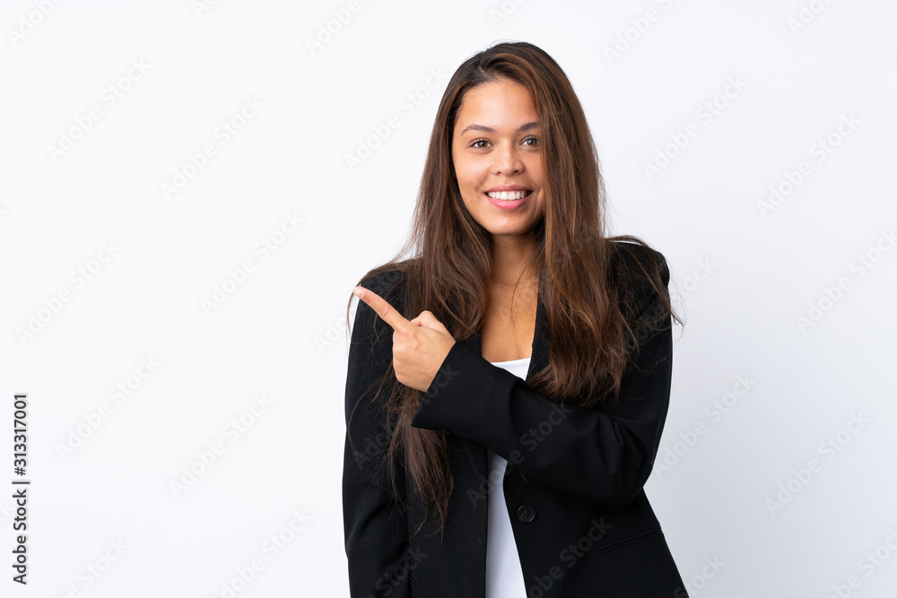 Young Brazilian girl with blazer over isolated white background pointing finger to the side Young Brazilian girl with blazer over isolated white background pointing finger to the side