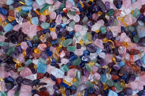 Healing Chakra Crystals Banner - Chakra colored tumbled healing stones. Crystal healing background photo