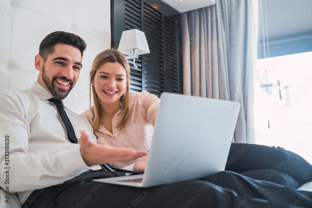 Two business people working together on laptop. Two business people working together on laptop.